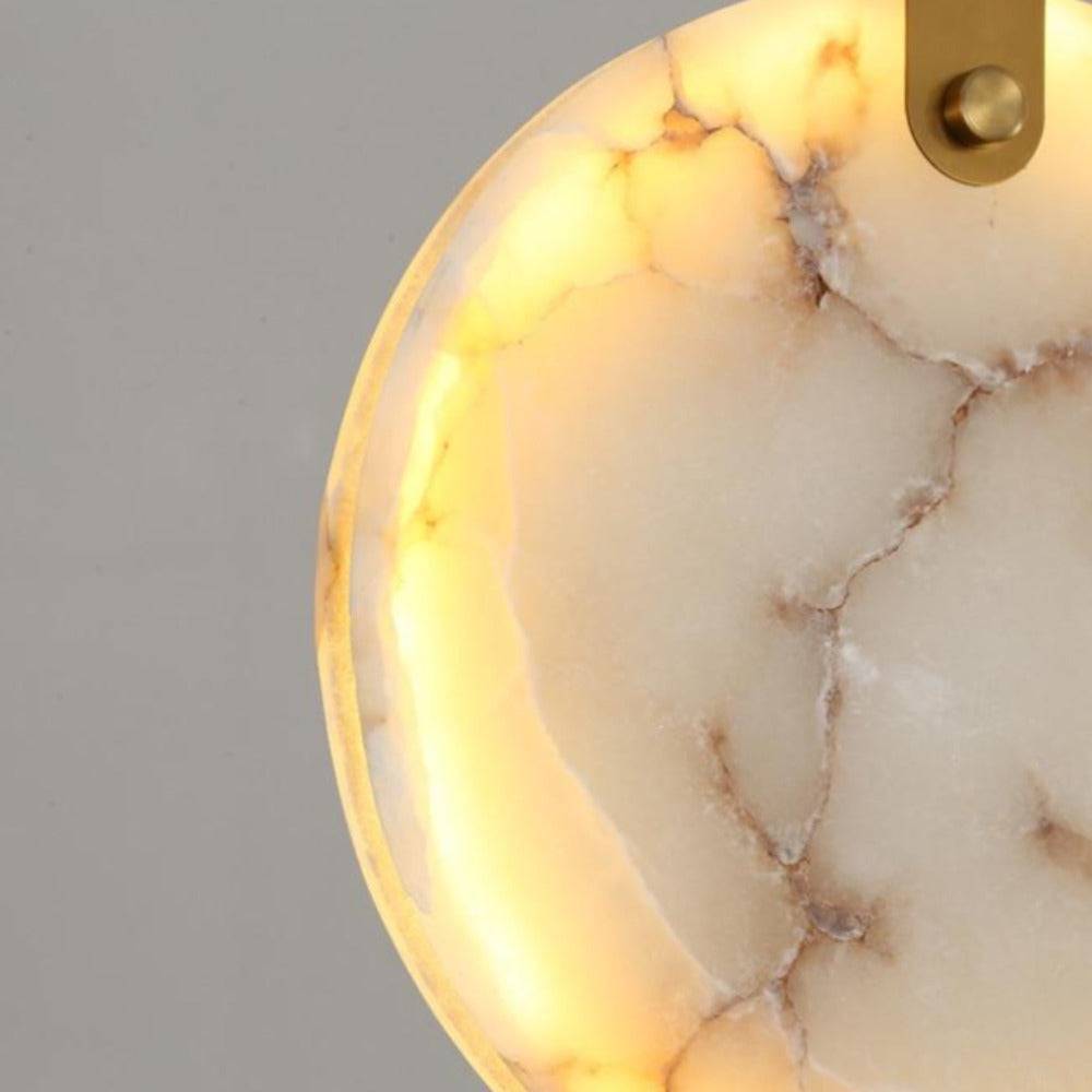 Moonshade marble chandelier warm glow through stone discs