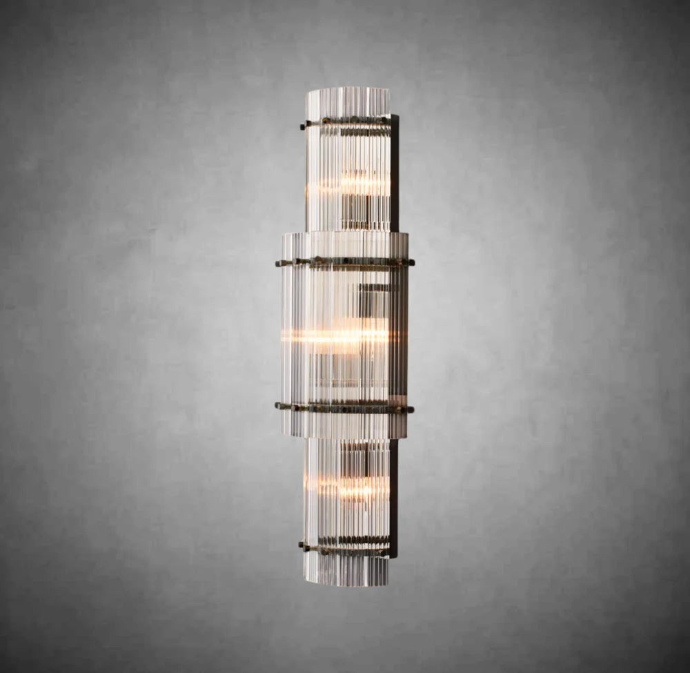 Decorative wall sconce with glass panels on a gray background