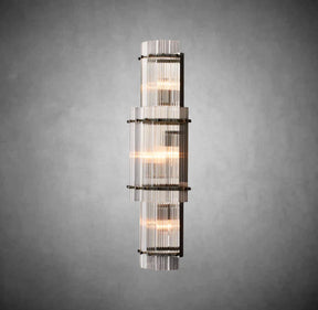 Decorative wall sconce with glass panels on a gray background